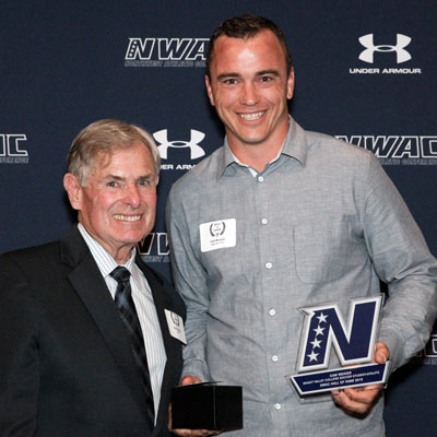 (Left to right) Dick McClain, former Northwest Athletic Conference Executive Director, congratulates Cam Weaver on his induction into the NWAC Hall of Fame