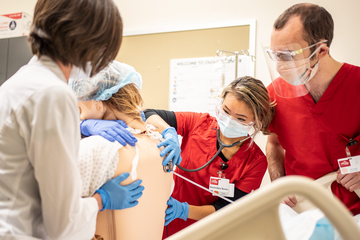 Nursing student setting up a plasma bag Nursing student setting up a plasma bag