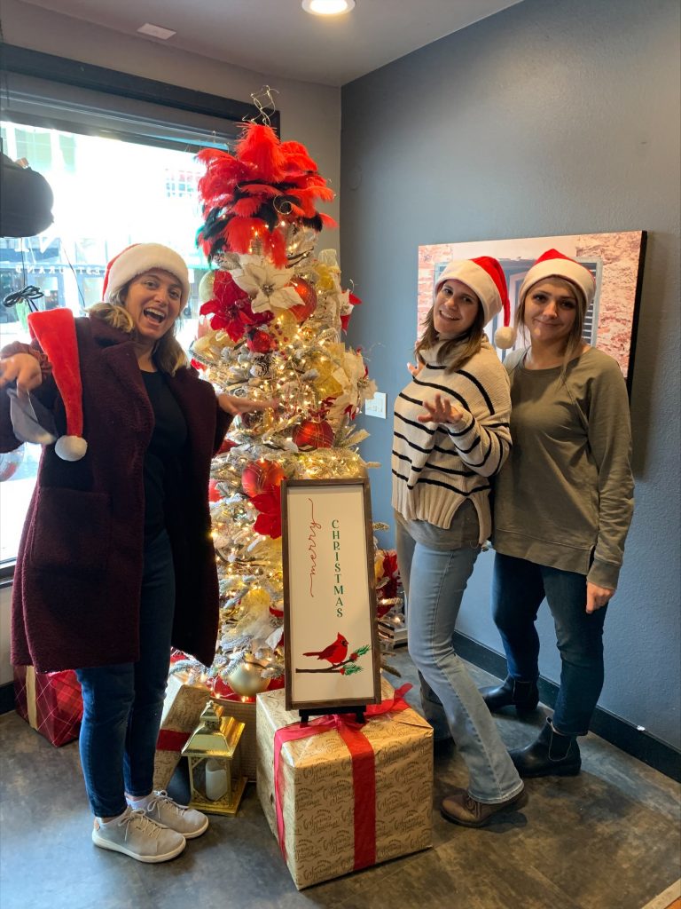 SVC Student Nurse Club members Alaina Schwartz, Janelle Maddox, and Yuliya Golubovich celebrate the completion of the club’s community service project for Skagit Valley Hospital’s Festival of Trees and Silent Auction.