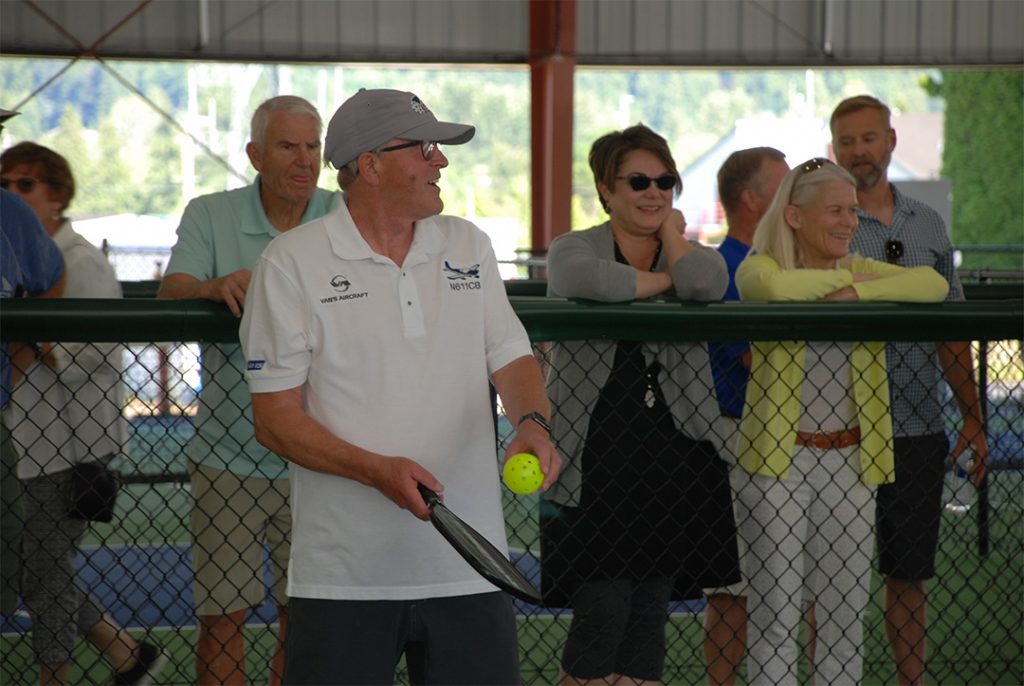 Claude Blackburn takes the first serve in the first match played at the Blackburn Pickleball Pavilion.