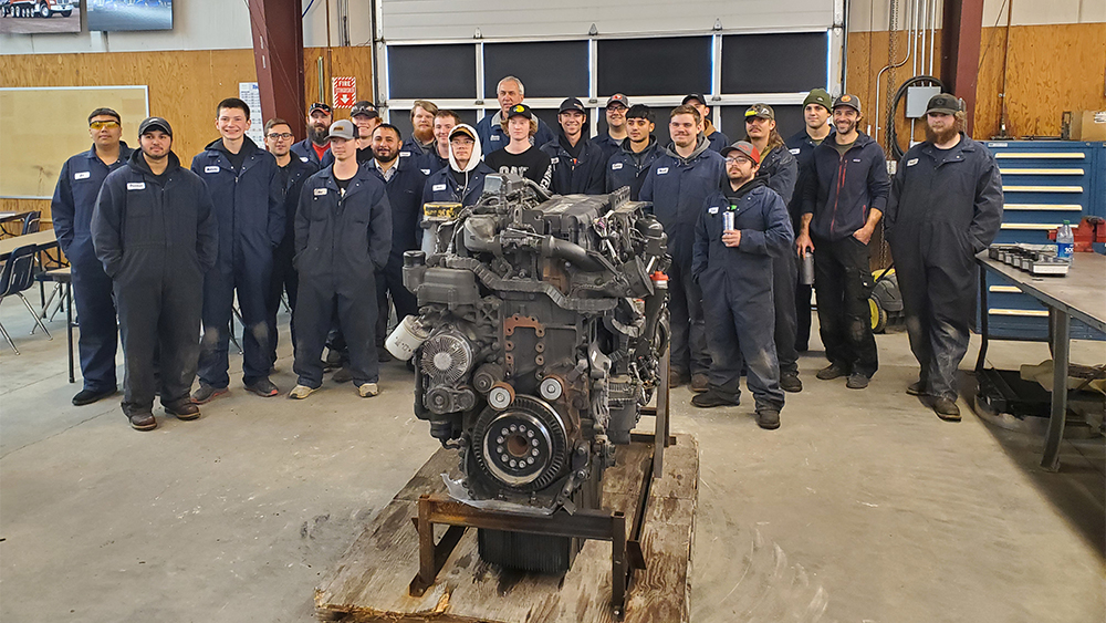 Bernie Andringa, SVC diesel technology instructor, and SVC diesel technology students 